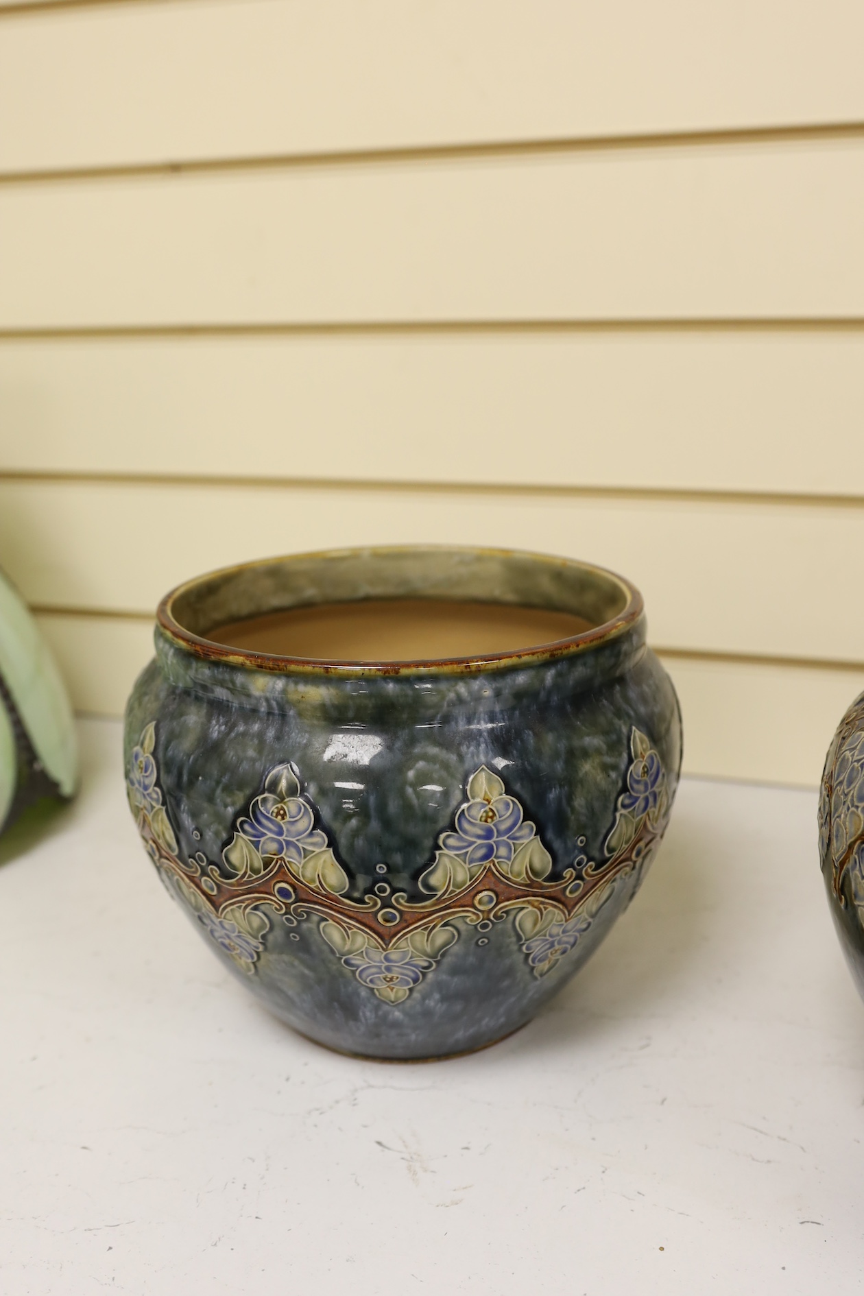 Two Royal Doulton early 20th century stoneware jardinieres and a similar stoneware bowl, tallest jardiniere 22cm high. Condition - frilled edge jardiniere chipped